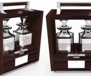 The Tantalus in a lockable Macassar ebony and dark stained walnut case comes with nic...