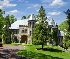 Park-like tranquility sets the stage for this majestic Old World stone manor amidst 1...